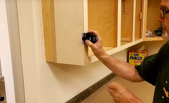 FastCap Tri Trimmer Carbon Steel Edge Band Trimming Tool, close-up view of tool trimming veneer edge on cabinetry