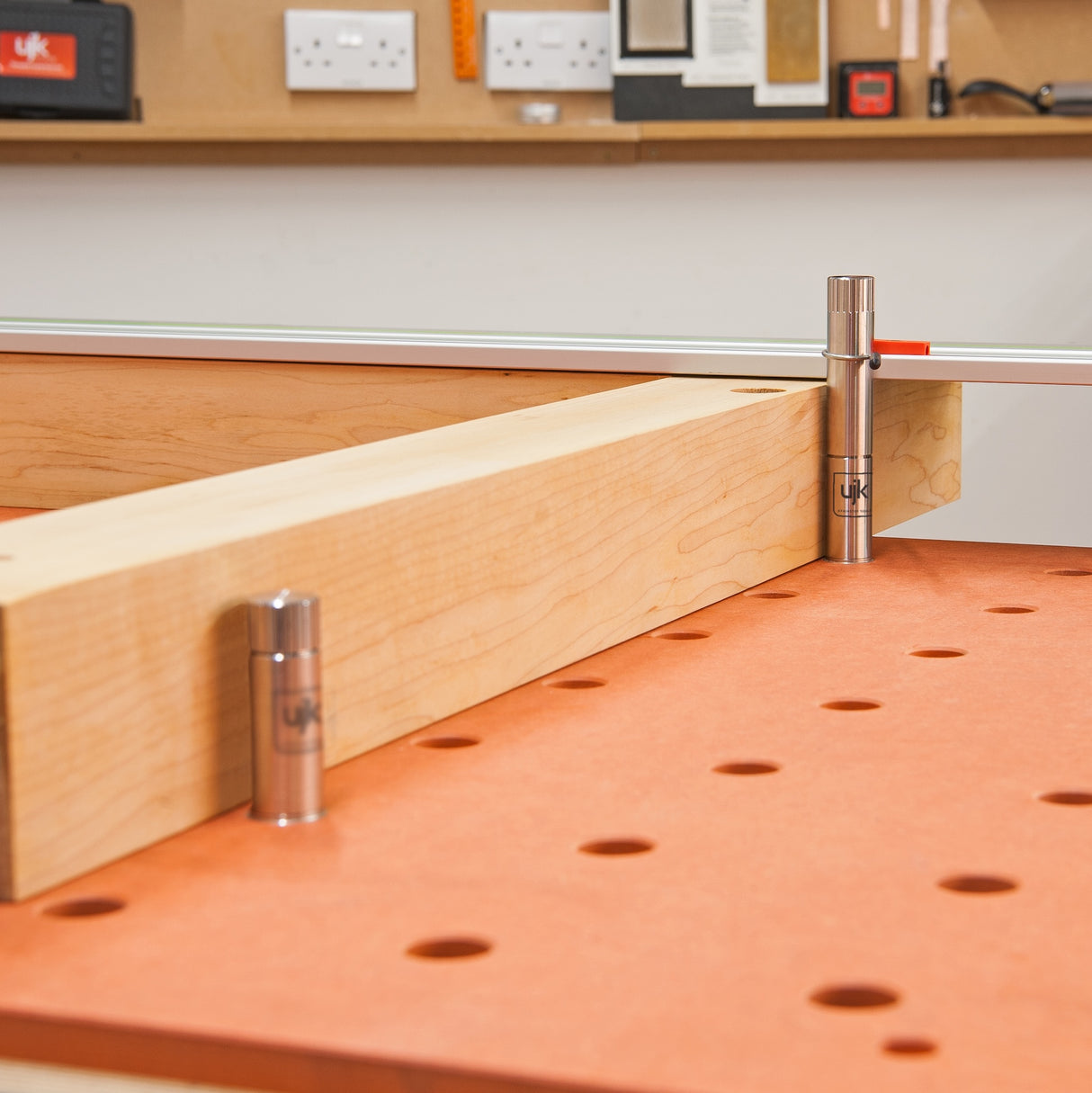 UJK Long Super Dog 20mm Bench Dog in use with guide track on multifunction workbench, extending plunge saw cutting capabilities