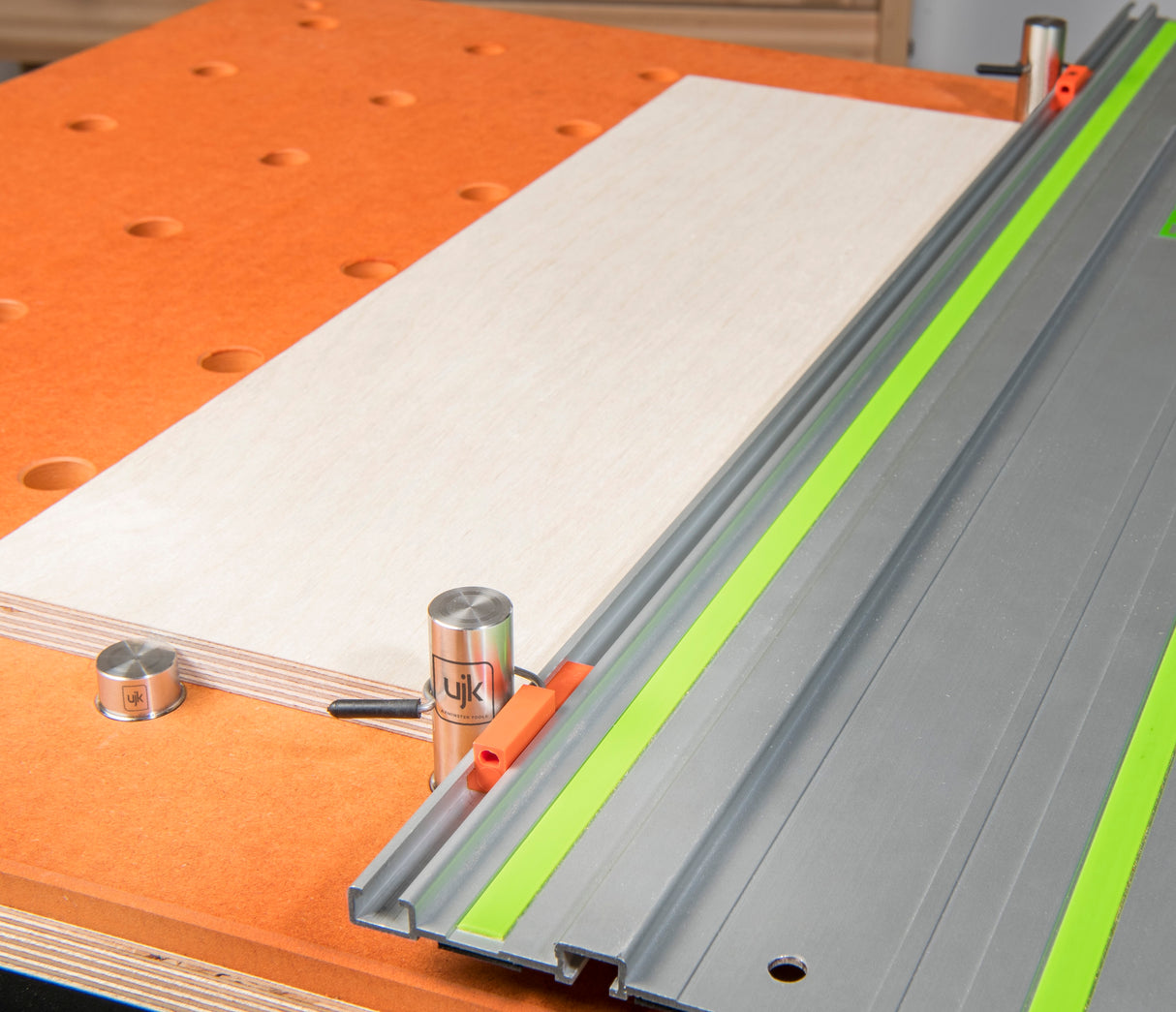 UJK Guide 20mm Bench Dogs 50mm Projection Pack of 2 in use on a grid table with chamfered 20mm holes