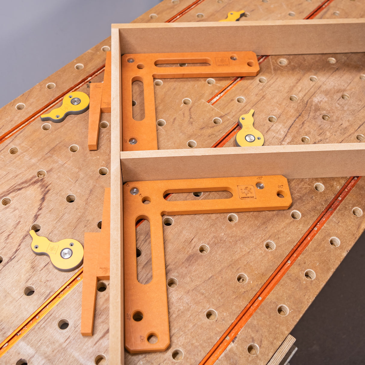UJK Cam & Wedge Clamping Set in use on a 20mm dog hole workbench