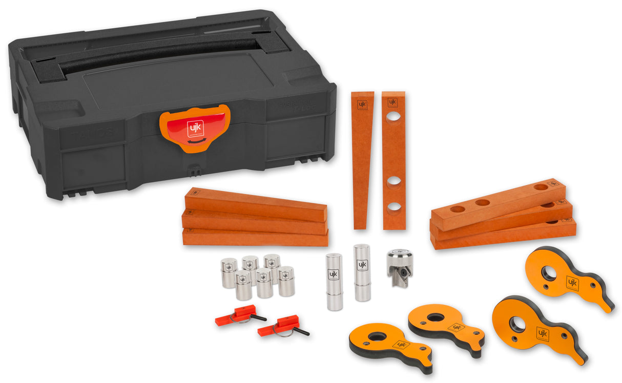 UJK Work Holding Accessory Kit in T-Loc Case on woodwork bench with assortment of clamps, wedges, stops, guide pups, and dogs