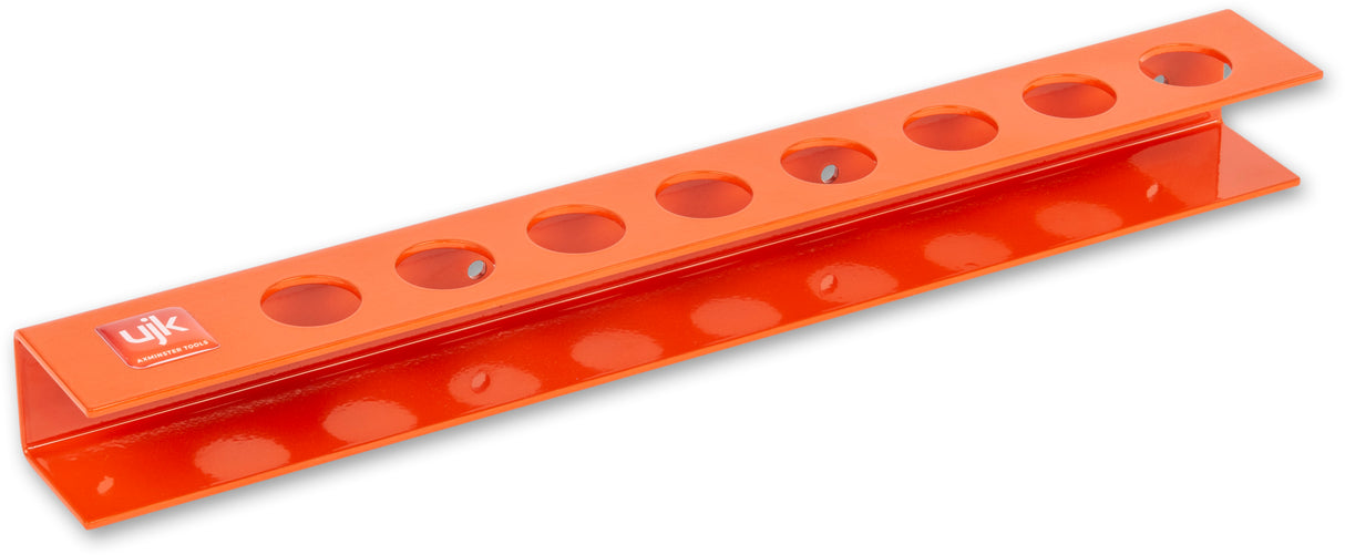 Wall-mounted UJK Dog Rack storing 8 Bench Dogs 19-20mm, keeping tools organized and easily accessible in Australian woodworking workshop