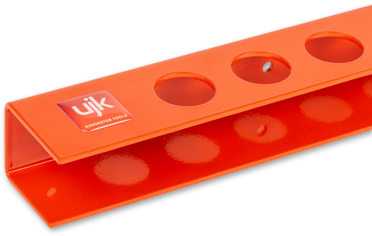 UJK Storage Pack for 8 Bench Dogs, designed for 19-20mm diameter, displayed on wall rack next to workbench