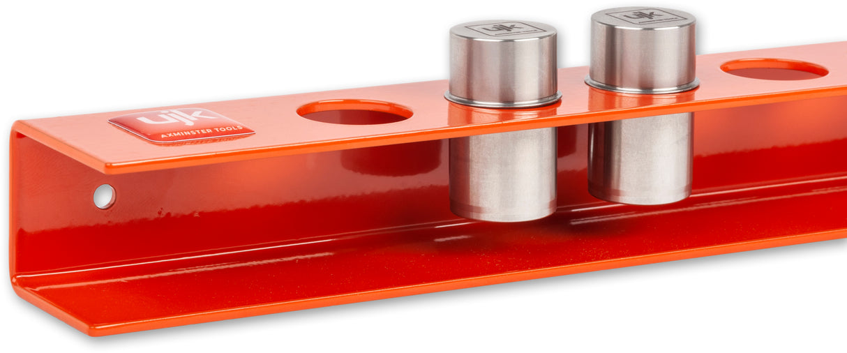 UJK Storage Pack for 8 Bench Dogs 19-20mm securely mounted on wall beside workbench