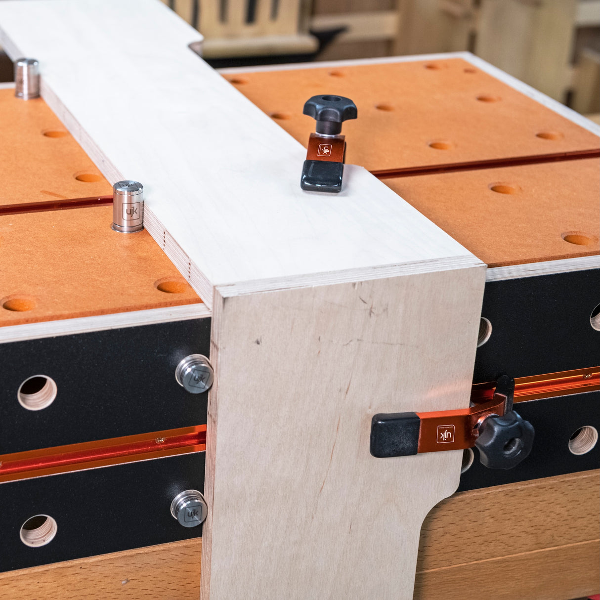 Compact UJK workbench with T-Track and 20mm dog holes, ideal for on-site and small workshop use