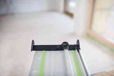 Festool FS Guide Rail Hose Guide Deflector installed on woodworking tool for precise cable and suction hose guidance