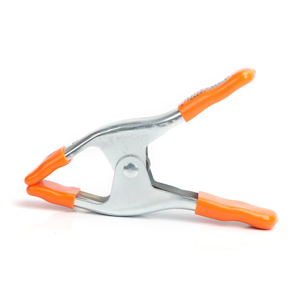 Pony Jorgensen Metal Spring Clamp 51mm Capacity with Protectors in action on wood piece