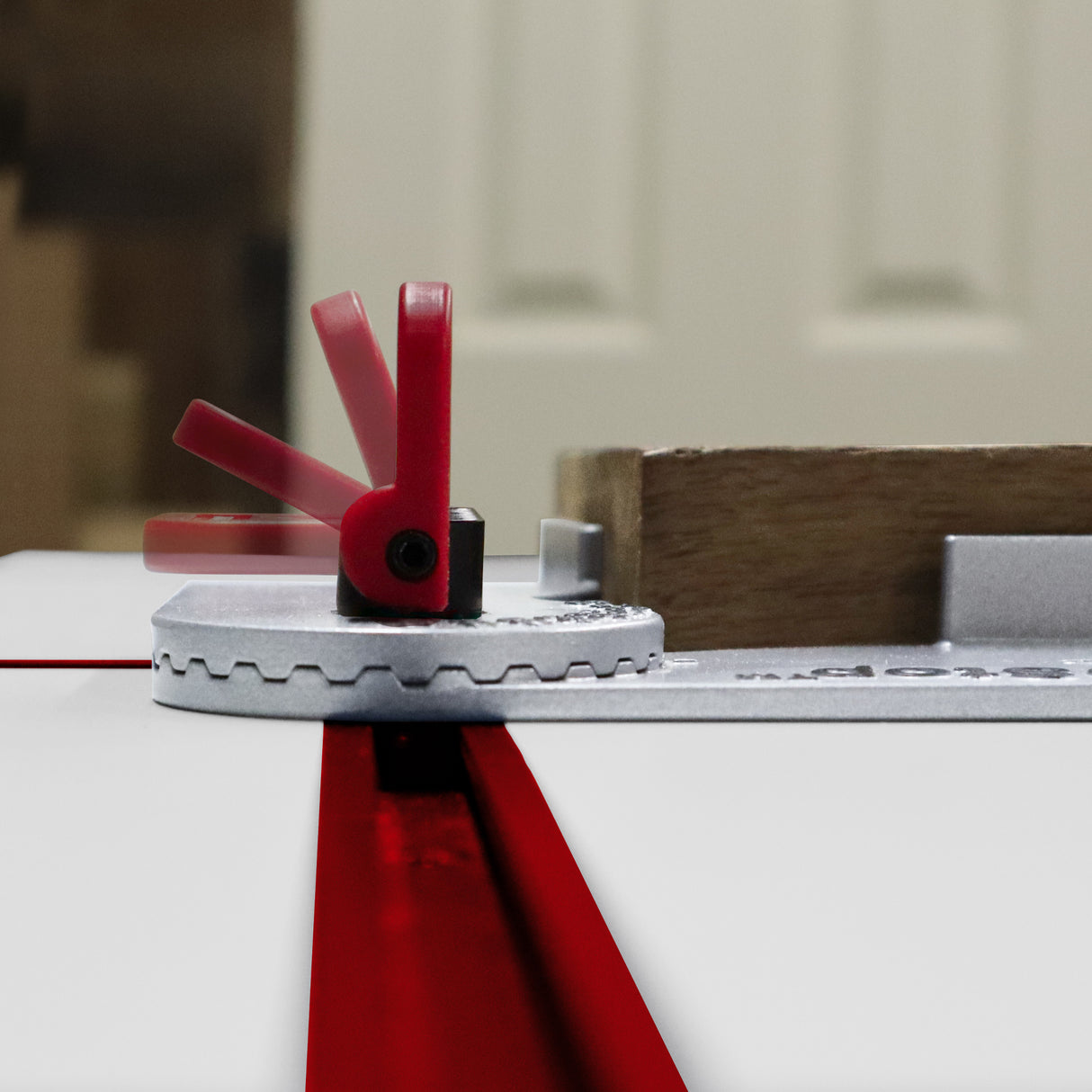 Adjustable Milescraft T-Track AngleStop supporting angled work pieces, with cam-handle design for quick adjustments