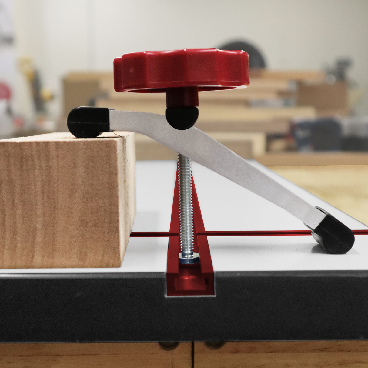 Milescraft Pack of 2 T-Track HoldDown200 Clamps with Non-Marring Rubber Tips - Side view of the clamps in action