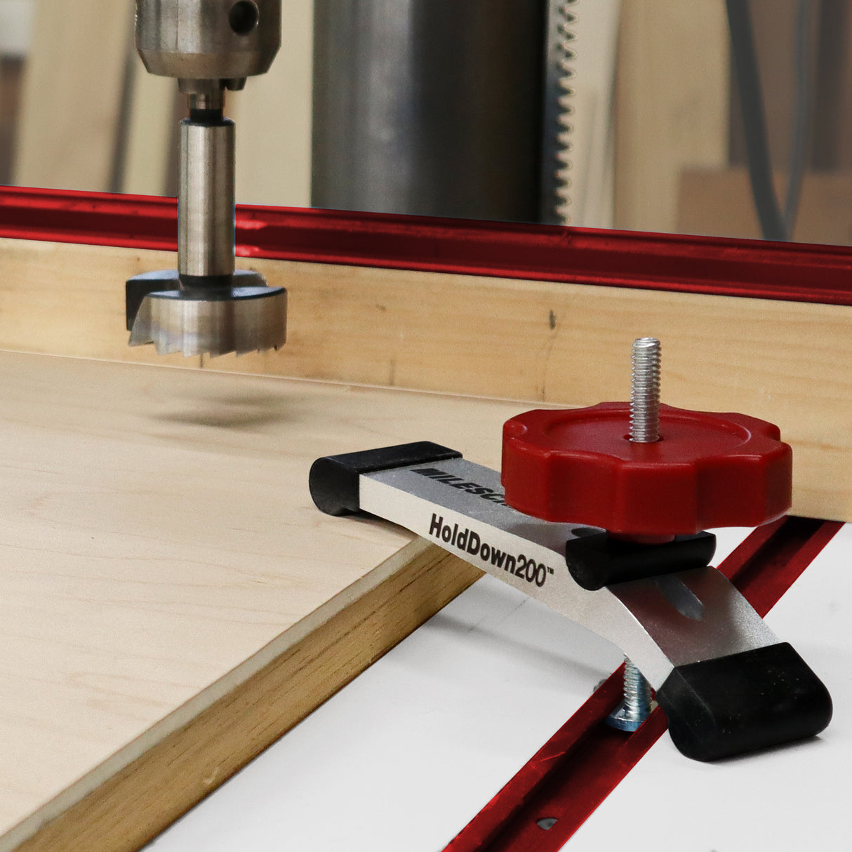 Two Milescraft T-Track HoldDown200 Clamps with Non-Marring Rubber Tips in action