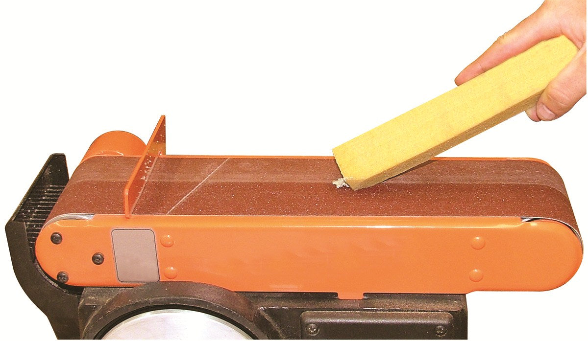 Abrasiflex Sandpaper Cleaning Sticks for Machine Sanders - Wooden sanding belt being cleaned with stick