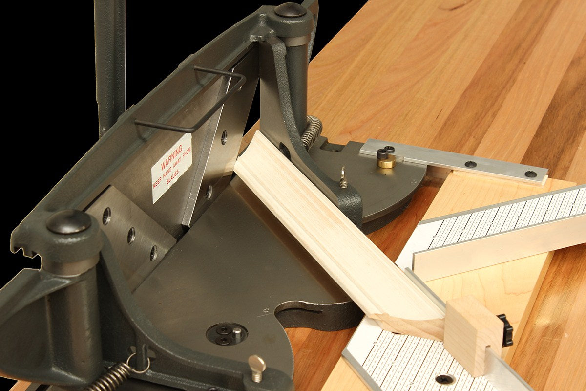 Hand Mitre Trimmer showing precise blade adjustment for professional picture framing