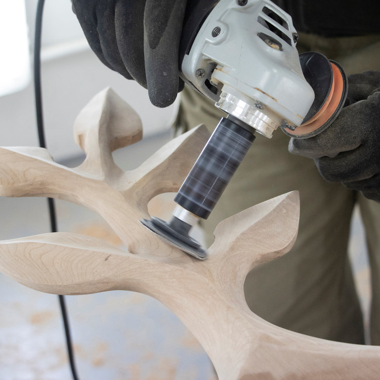 Arbortech Contour Sander in action on woodwork with M14 thread attachment and sanding discs