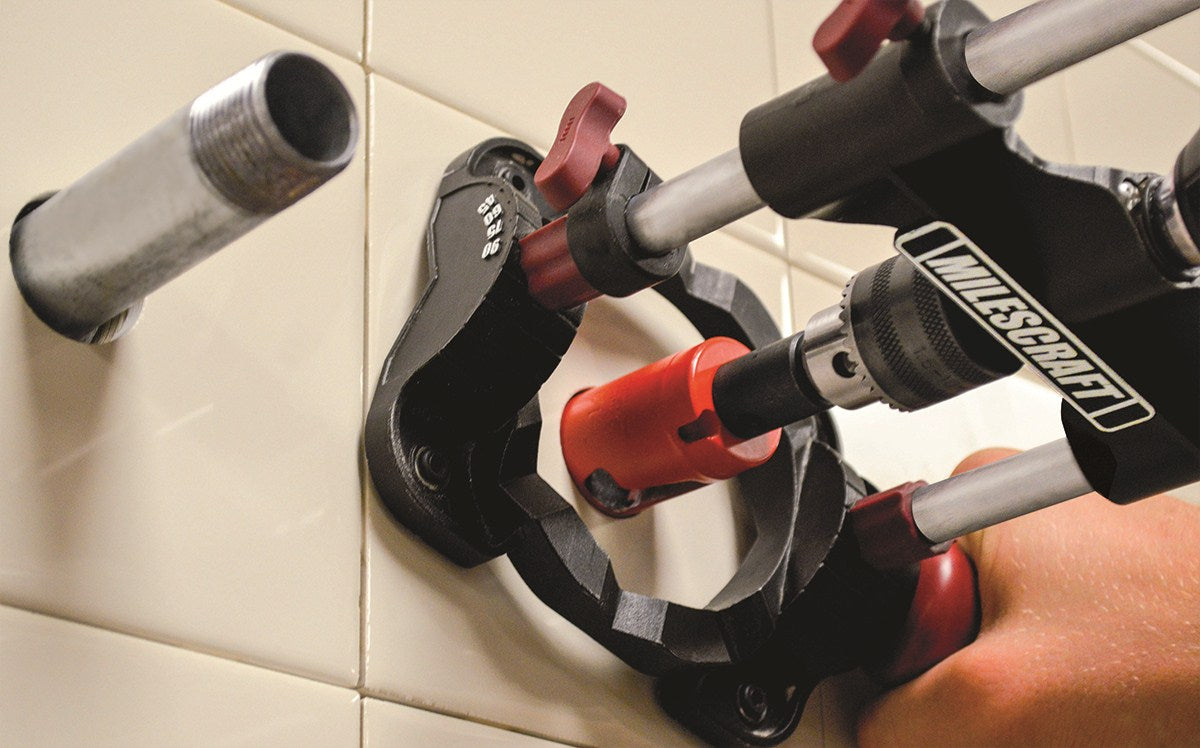 Milescraft Drill Mate Portable Drill Guide in use on a wooden surface with a power drill