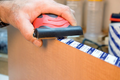 Fastcap Speed Roller Pro Laminate Roller with Rubber Wheels in use on laminate surface