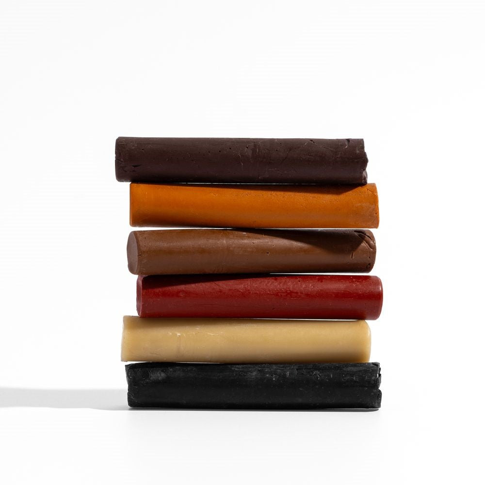 Set of 6 beeswax filler sticks in various wood tones for repairing cracks and holes on wood surfaces