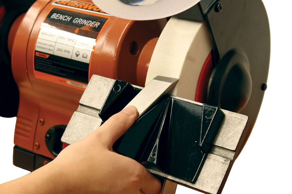 Sherwood Bench Grinder Toolrest Sharpening Jig in use with 70° guides for skew chisels on Baladonia CJ-05 Tool Rest