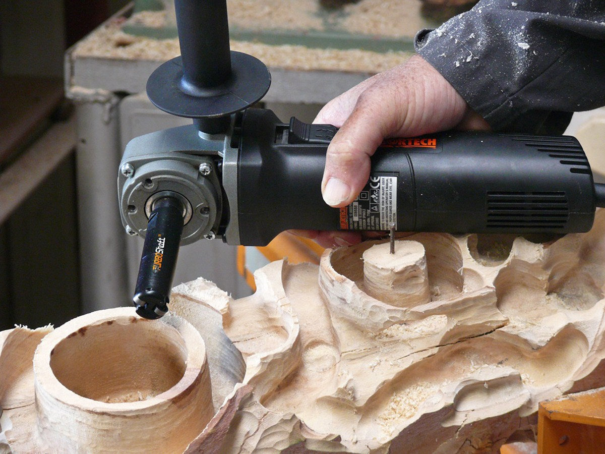 Arbortech Turbo Shaft Carving Attachment in action on a wood surface