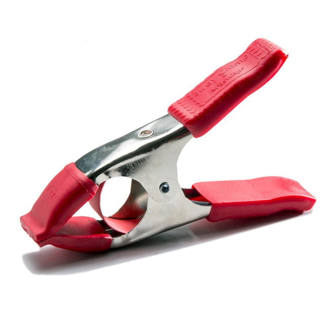 Fastcap 3 Way Edge Banding Spring Clamp applying pressure from three angles