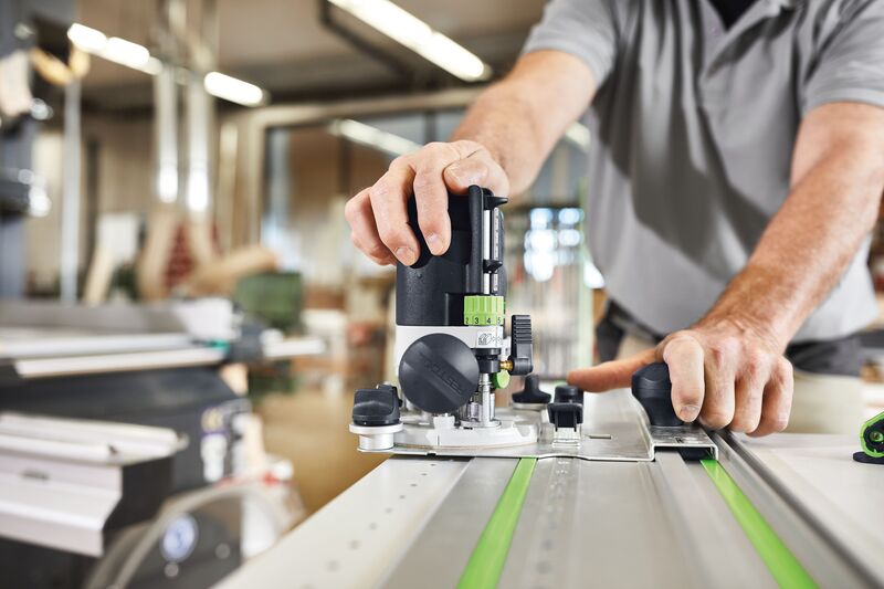 Festool OF 1010R Plunge Router with LED light ring, double-sided column clamp, and parallel side fence for precise woodworking