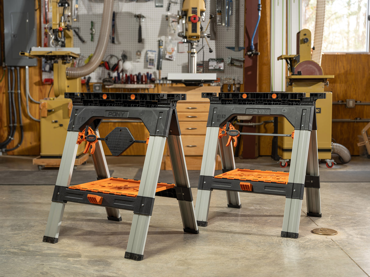 Pony Jorgensen 2-Piece Clamping Sawhorse with clamps and bench dogs in use at a woodworking workshop