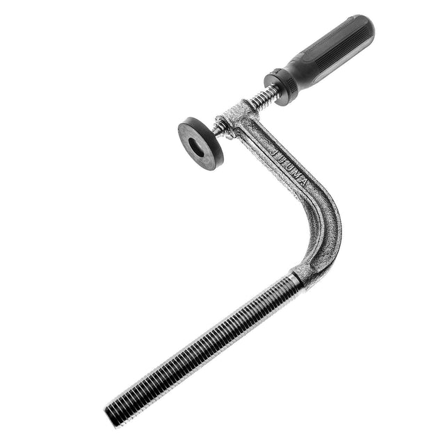 Torquata Heavy-Duty Bench Holdfast in use on workbench, showing ergonomic grip and rubber pressure plate