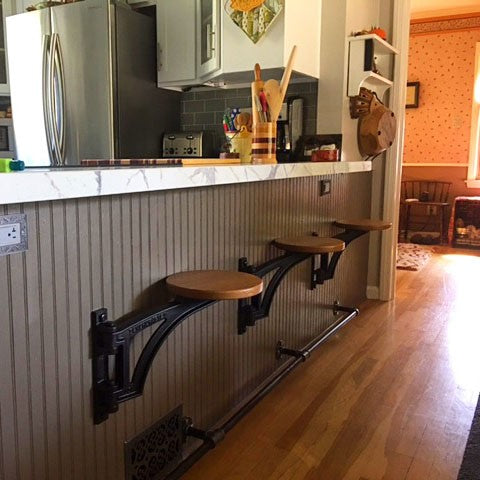 Benchcrafted Swing Away Seat Hardware for Workbench Mounted Seat in workshop setting