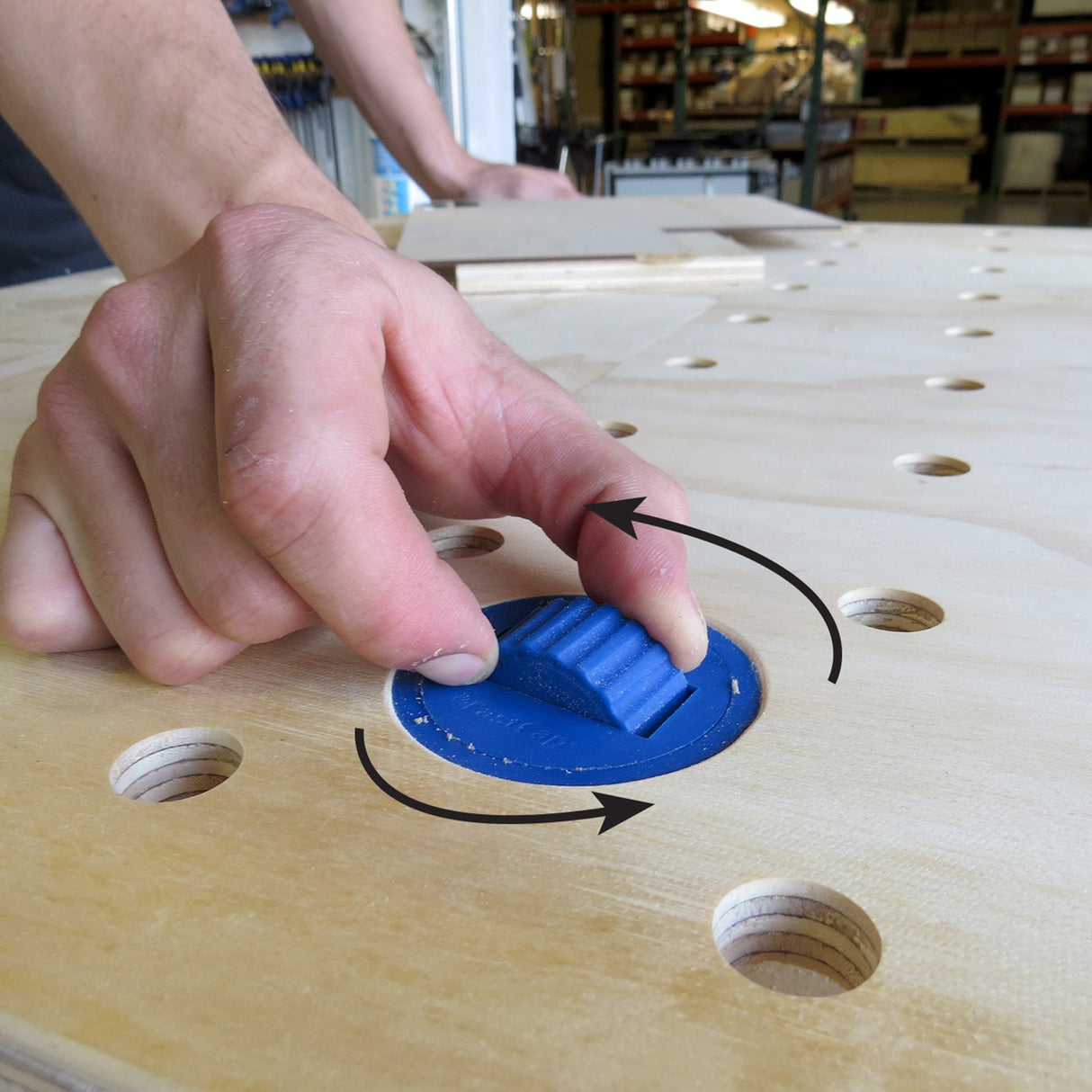 FastCap Blue Dog Bench Dogs Pack of 4 in use on workbench with 2½" dog holes