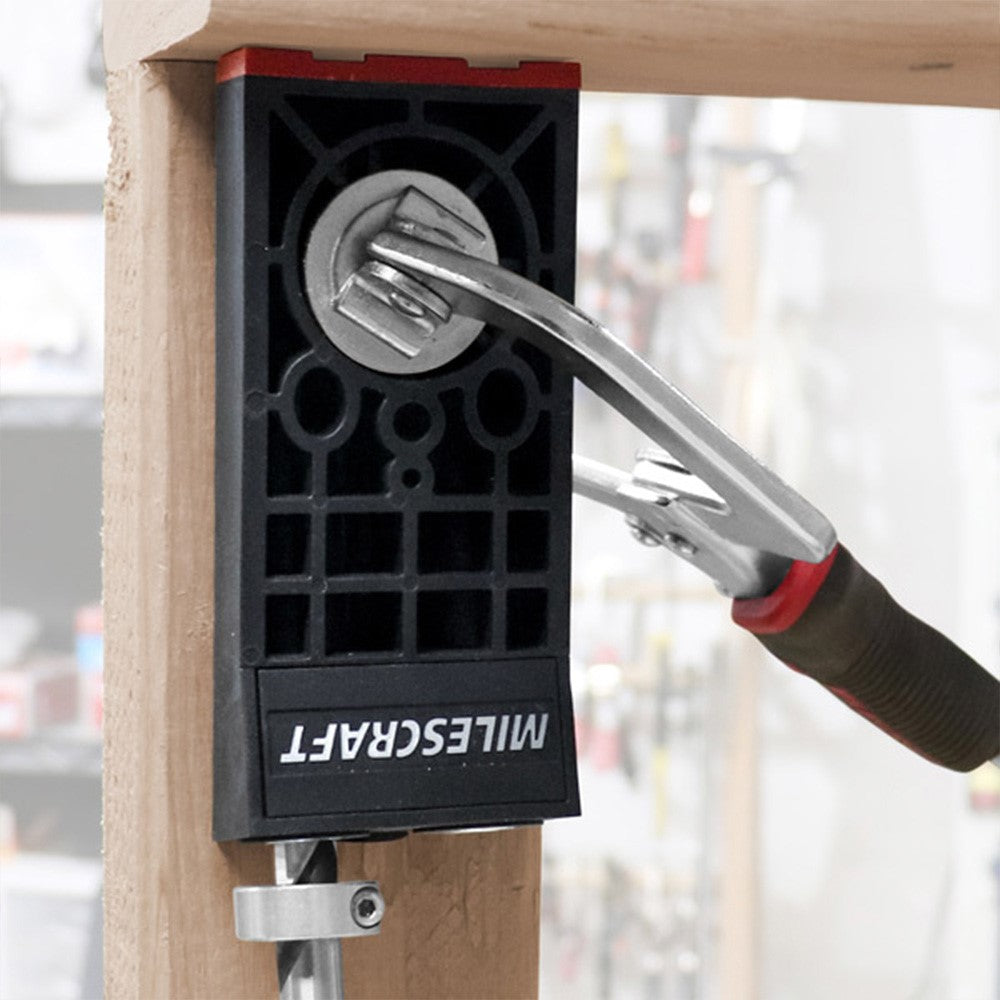 Milescraft PocketJig300 heavy-duty portable clamp on joinery jig in use on a wooden board