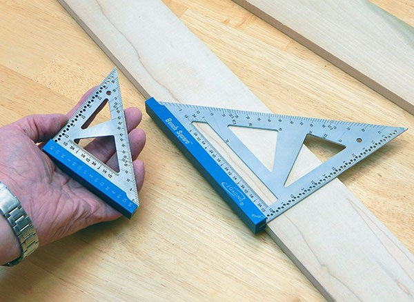 iGaging Set of 2 Bench Squares Metric Stainless Steel held in hand, showcasing precision woodworking tool craftsmanship