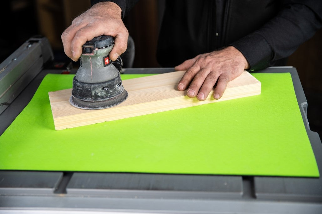 BOW Products Non-Slip Bench Mat 610 x 450mm in woodworking workshop, organizing tools securely