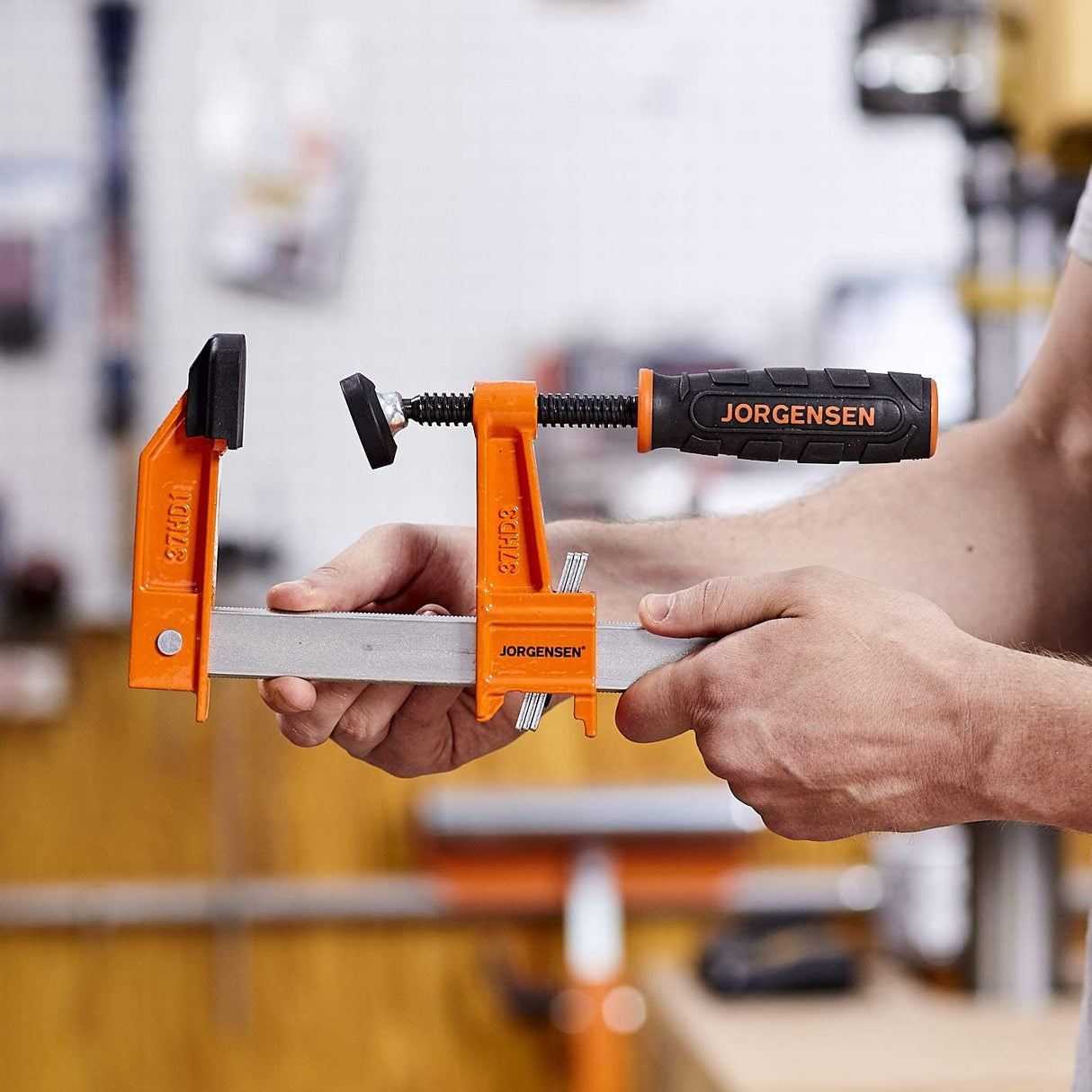 Pony Jorgensen Heavy Duty Steel Bar Clamp in use by a carpenter