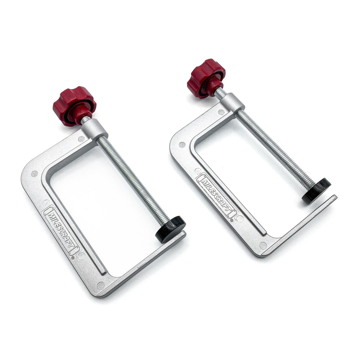 Milescraft TrackClamps for T-Track with 4in Clamping Capacity, ergonomic knob and non-marring swivel pad on a woodworking table