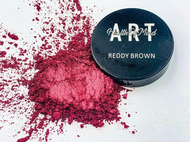 Health of Mind Art Reddy Brown 50g Pearlescent Pigment Mica Powder for Epoxy Resin displayed on wooden surface