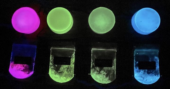 Health of Mind Art Aqua Blue 25g glow in the dark pigment powder for epoxy resin in pouch on wooden surface