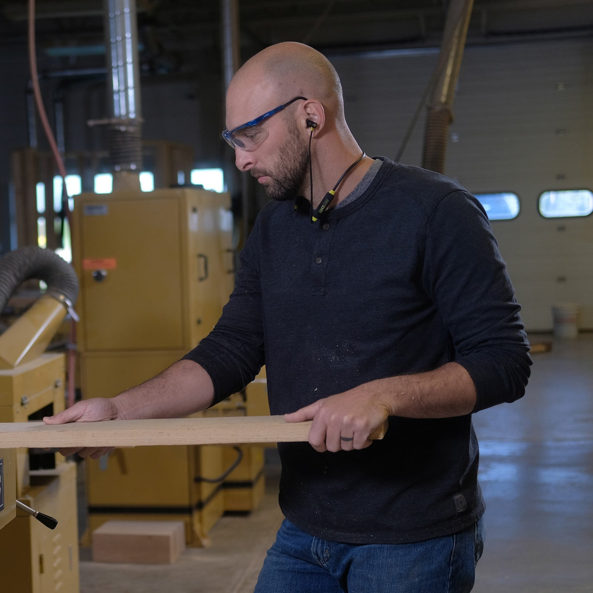 ISOtunes XTRA 2.0 Bluetooth Noise-Isolating Earbuds in yellow and black colour scheme