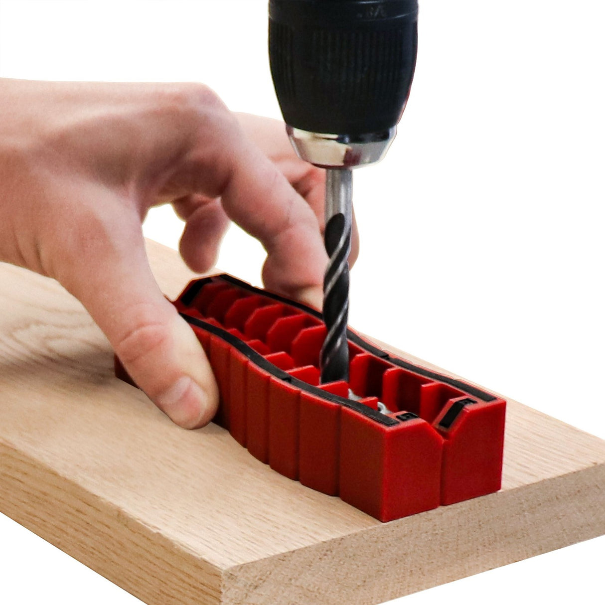 Hand-held Milescraft DrillBlockPlus with 9 holes drill guide bushing block