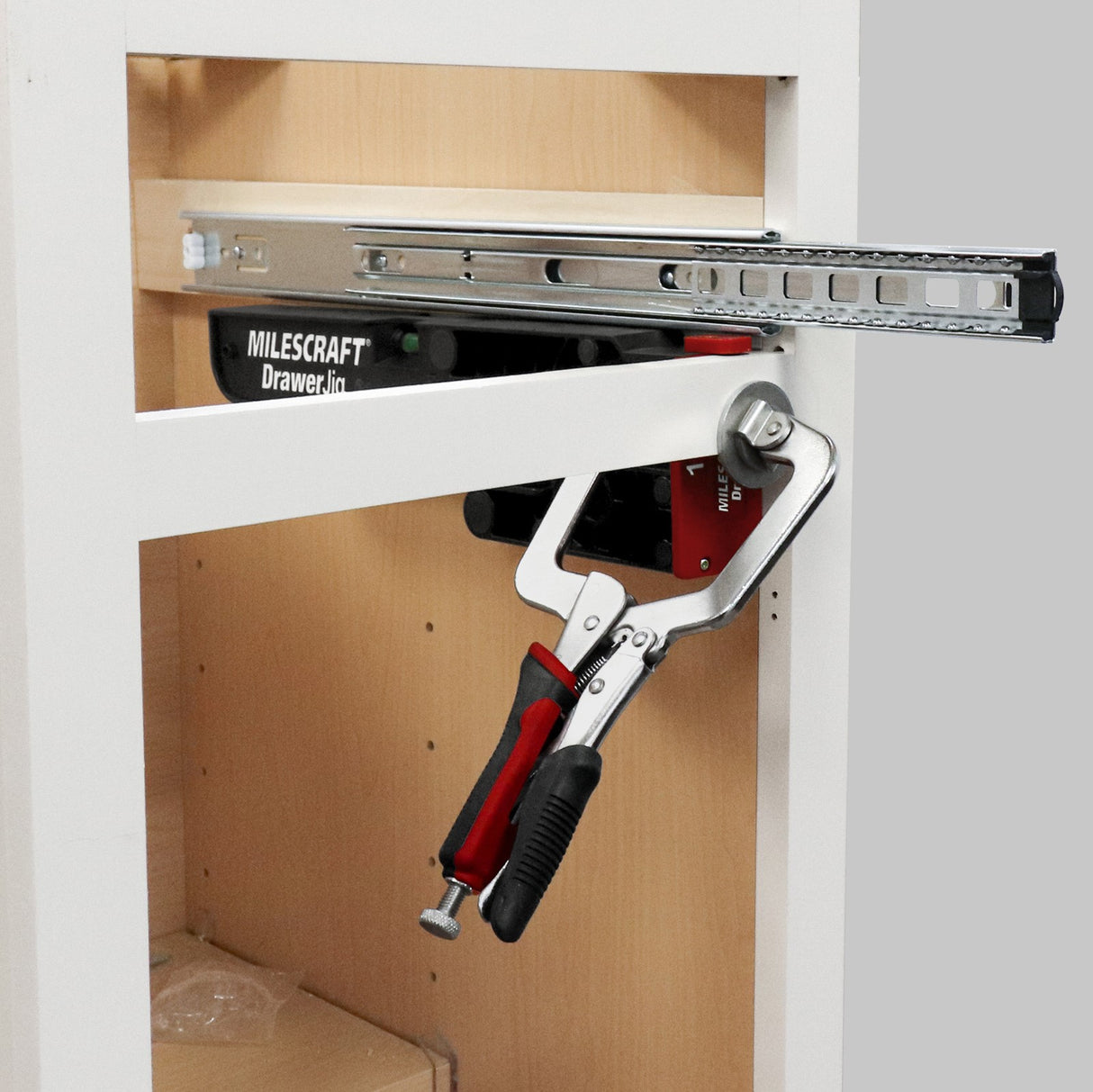 Milescraft DrawerJig metal drawer runner installation jig in use
