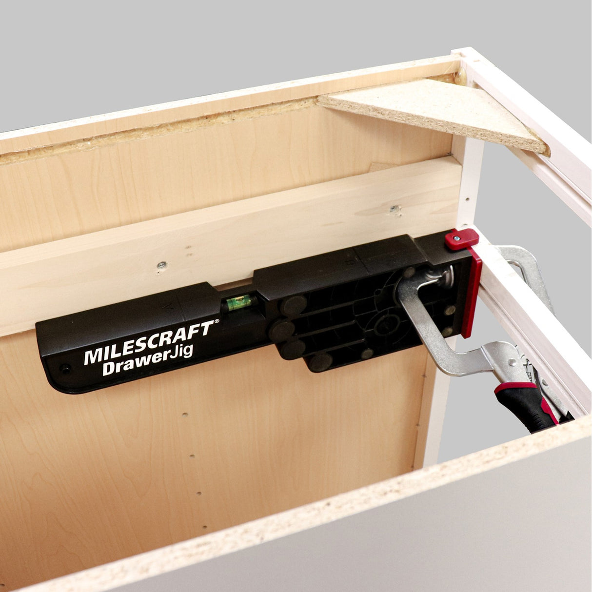 Milescraft DrawerJig metal drawer runner installation jig in use on woodworking project