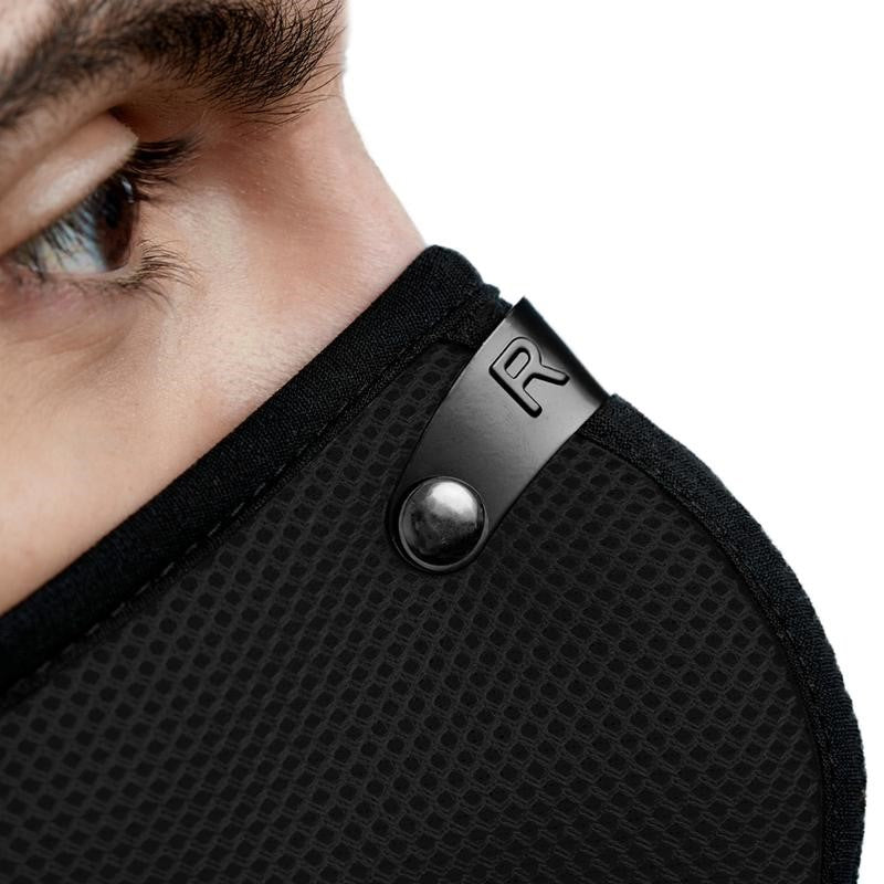 RZMask M2 Dust Face Mask in Black with Replaceable Filters, angled view showcasing breathable mesh design