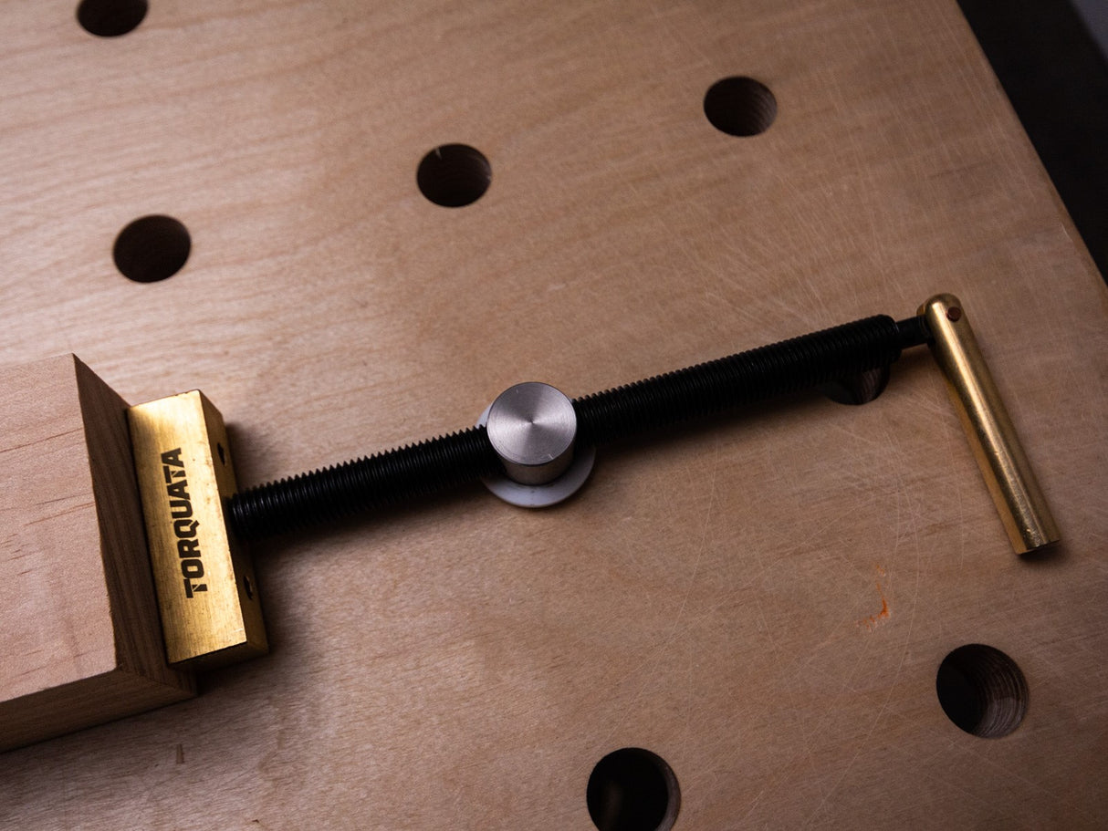 Torquata 19mm Horizontal Bench Dog Clamp in action on woodworking bench