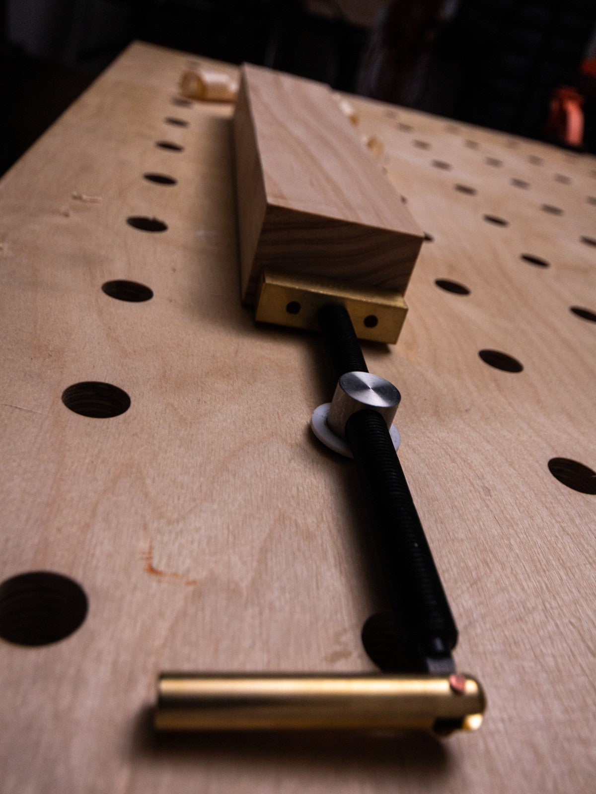 Torquata 19mm Post Horizontal Bench Dog Clamp in use on woodworking bench