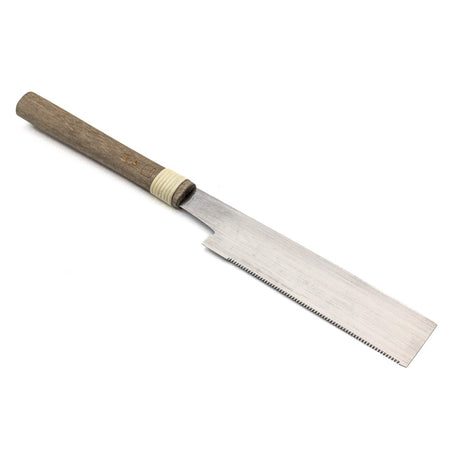 Handmade 150mm Mitsukawa Flush Cut Japanese Saw in action on wood surface