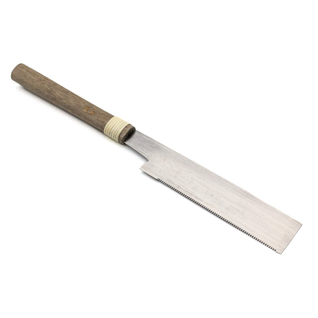 Handmade 150mm Mitsukawa Flush Cut Japanese Saw in action on wood surface