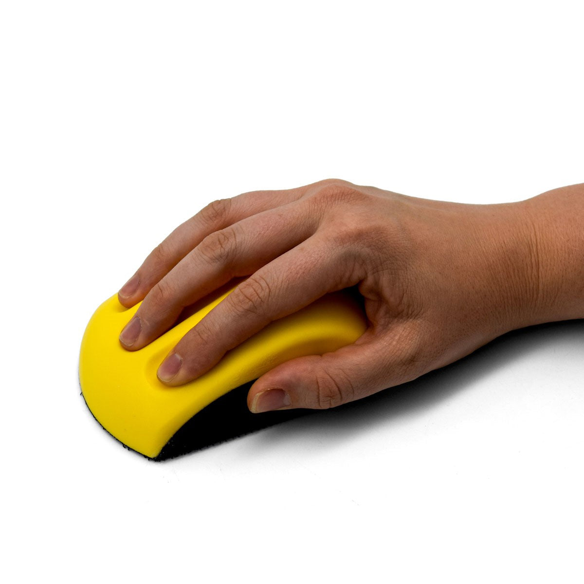 Flexible hand sanding pad with angled sides for sanding grooves and tight spots