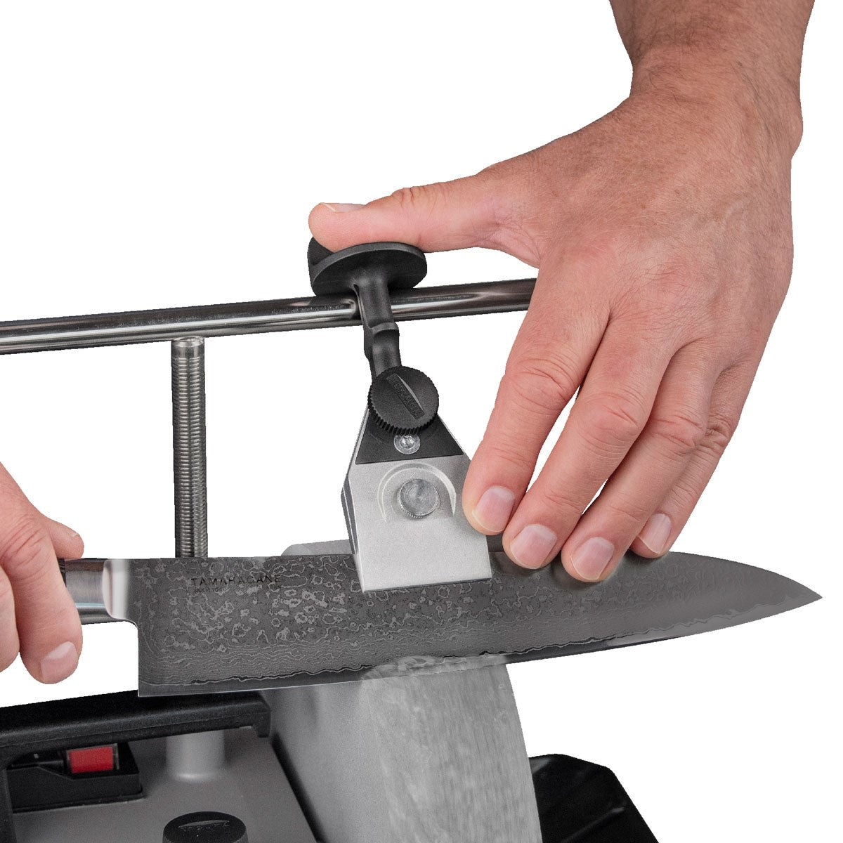 Tormek Wetstone Grinder Centering Knife Jig in use on woodworking tool