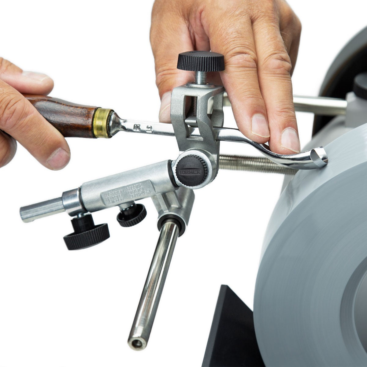 Tormek Wetstone Grinder Gouge & Turning Tool Jig in use, showcasing precise sharpening process