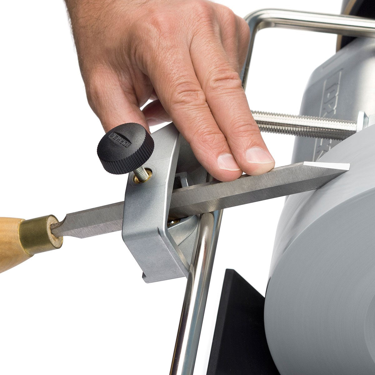 Tormek Wetstone Grinder Multi Turning Tool Jig in use, showcasing precision sharpening process