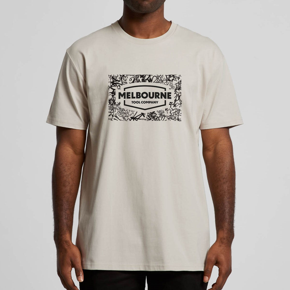 Melbourne Tool Company Antique White T-Shirt with Grafitti Logo on street art backdrop