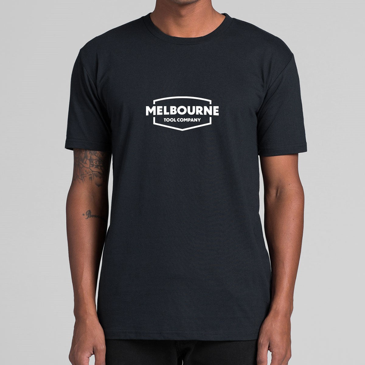 Melbourne Tool Company black T-shirt with white Chevron logo, a stylish addition to any woodworker's wardrobe